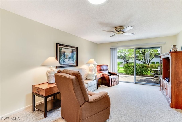 6843 Bogey Dr, Fort Myers, FL 33919 - living area with light carpet, ceiling fan, and a textured ceiling