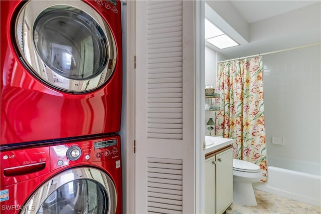 6843 Bogey Dr, Fort Myers, FL 33919 - washroom featuring stacked washer / dryer and tile patterned flooring