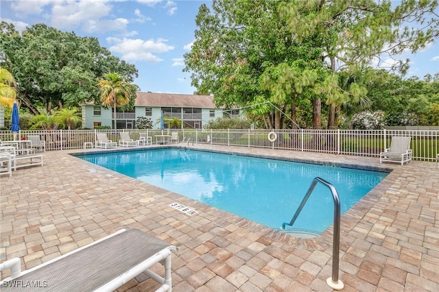5737 Whitaker Rd Unit C203, Naples, FL 34112 - community pool with a patio area