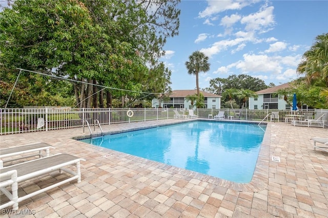 5737 Whitaker Rd Unit C203, Naples, FL 34112 - community pool featuring a patio