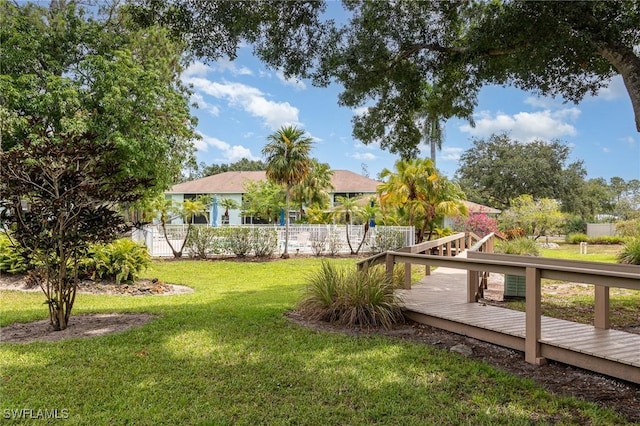 5737 Whitaker Rd Unit C203, Naples, FL 34112 - view of yard featuring a deck