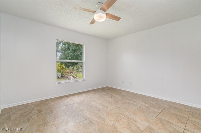5737 Whitaker Rd Unit C203, Naples, FL 34112 - unfurnished room featuring a ceiling fan and a textured ceiling