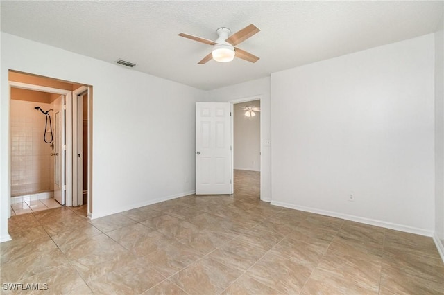 5737 Whitaker Rd Unit C203, Naples, FL 34112 - spare room with a ceiling fan, light tile patterned floors, and baseboards