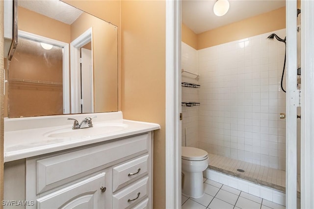 5737 Whitaker Rd Unit C203, Naples, FL 34112 - full bathroom with vanity, tiled shower, tile patterned flooring, and toilet
