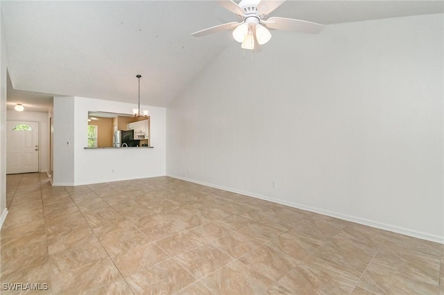 5737 Whitaker Rd Unit C203, Naples, FL 34112 - unfurnished living room with vaulted ceiling, ceiling fan, and baseboards