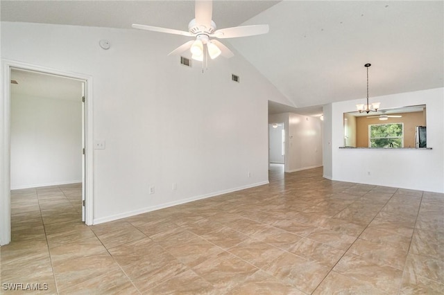 5737 Whitaker Rd Unit C203, Naples, FL 34112 - empty room featuring ceiling fan, high vaulted ceiling, and a chandelier