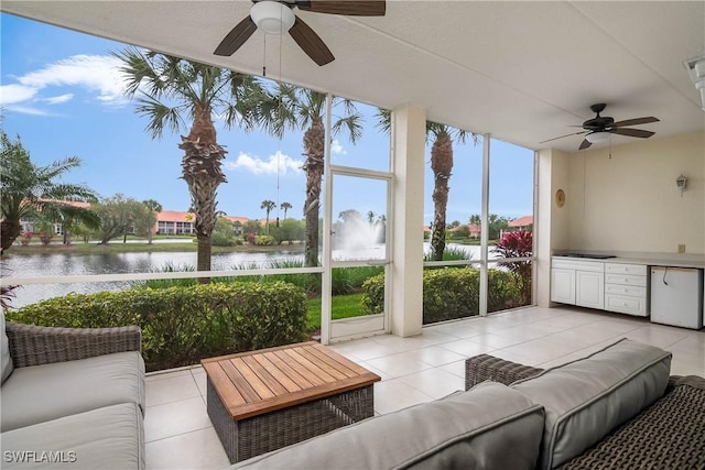 6810 Beach Resort Dr Unit 13, Naples, FL 34114 - sunroom featuring a water view and tile patterned floors