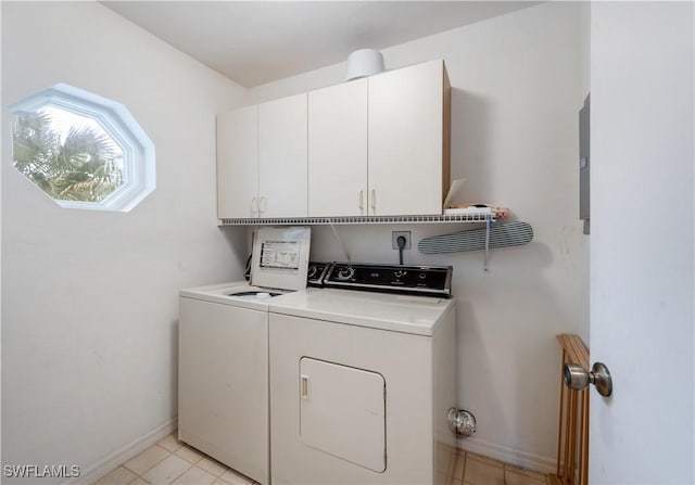2141 Tama Cir Unit 202, Naples, FL 34112 - laundry room featuring cabinet space, independent washer and dryer, and light tile patterned flooring