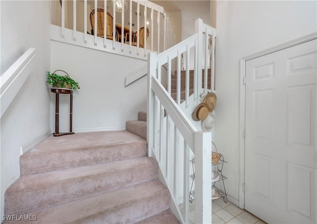 2141 Tama Cir Unit 202, Naples, FL 34112 - stairway featuring carpet floors
