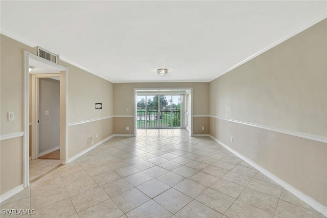 1051 Foxfire Ln Unit 309, Naples, FL 34104 - spare room with light tile patterned flooring, ornamental molding, and baseboards