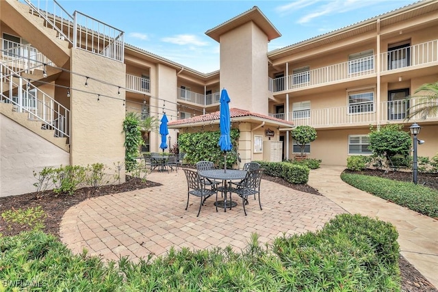 1051 Foxfire Ln Unit 309, Naples, FL 34104 - view of patio with outdoor dining space