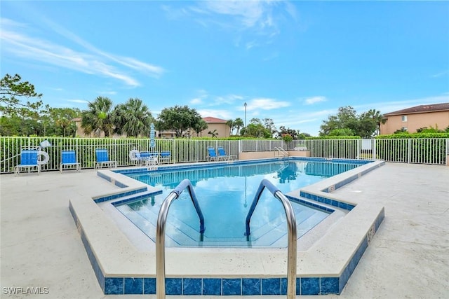 1051 Foxfire Ln Unit 309, Naples, FL 34104 - community pool featuring a patio area and a jacuzzi