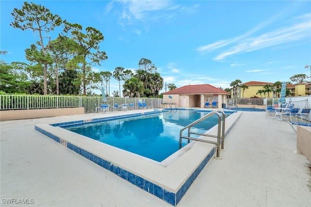 1051 Foxfire Ln Unit 309, Naples, FL 34104 - community pool with a patio area