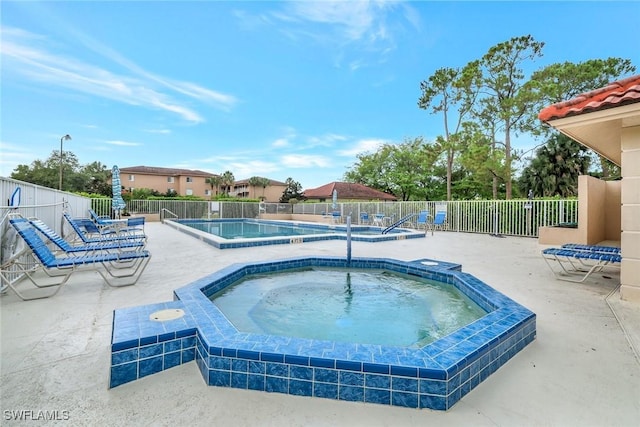 1051 Foxfire Ln Unit 309, Naples, FL 34104 - community pool with a hot tub and a patio area