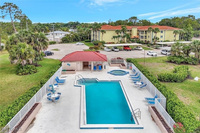 1051 Foxfire Ln Unit 309, Naples, FL 34104 - community pool with a community hot tub and a patio area