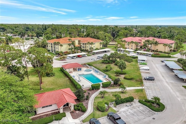 1051 Foxfire Ln Unit 309, Naples, FL 34104 - drone / aerial view of a pool