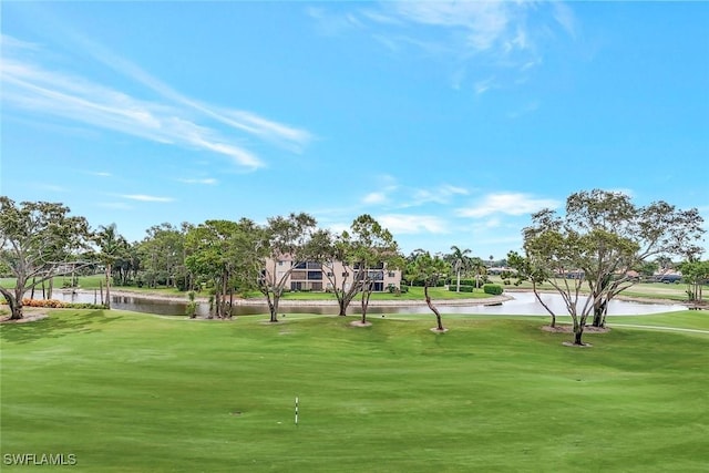 1051 Foxfire Ln Unit 309, Naples, FL 34104 - view of home's community with a water view, view of golf course, and a yard
