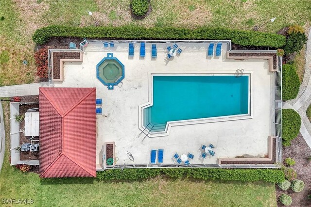 1051 Foxfire Ln Unit 309, Naples, FL 34104 - view from above of property featuring a pool area