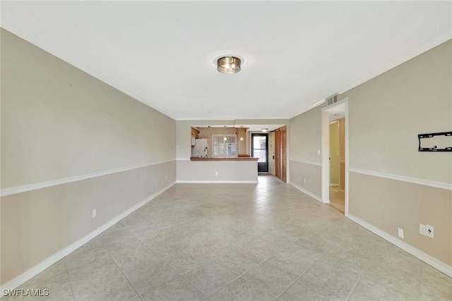 1051 Foxfire Ln Unit 309, Naples, FL 34104 - unfurnished living room with baseboards, light tile patterned floors, and crown molding