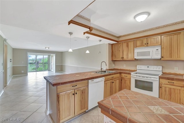 1051 Foxfire Ln Unit 309, Naples, FL 34104 - kitchen with white appliances, a sink, a peninsula, tile counters, and open floor plan