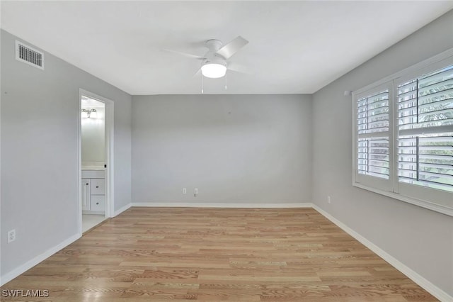 1051 Foxfire Ln Unit 309, Naples, FL 34104 - unfurnished room with light wood-style flooring, ceiling fan, and baseboards