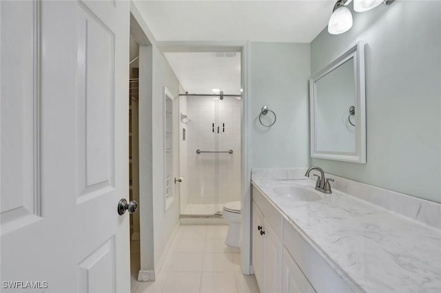 1051 Foxfire Ln Unit 309, Naples, FL 34104 - full bath featuring an enclosed shower, vanity, toilet, and tile patterned flooring