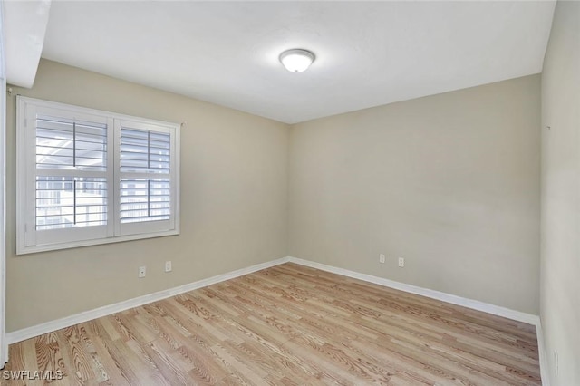 1051 Foxfire Ln Unit 309, Naples, FL 34104 - empty room with wood finished floors and baseboards