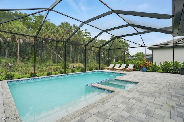 10415 Ventana Ln, Naples, FL 34120 - view of swimming pool with a pool with connected hot tub, a patio, and glass enclosure