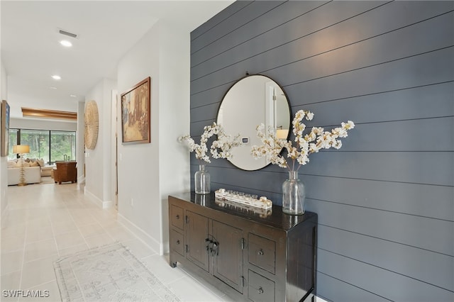 10415 Ventana Ln, Naples, FL 34120 - hall with tile patterned floors, recessed lighting, and wooden walls