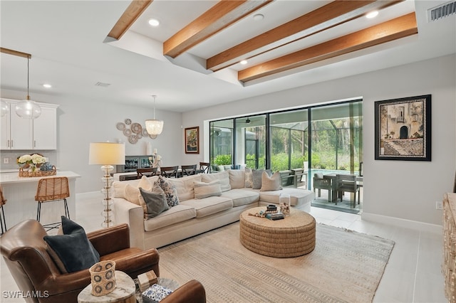 10415 Ventana Ln, Naples, FL 34120 - living room with beam ceiling, light tile patterned floors, recessed lighting, and a chandelier