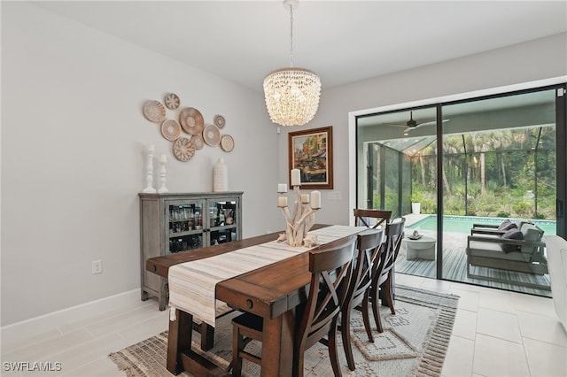 10415 Ventana Ln, Naples, FL 34120 - dining room with a chandelier, light tile patterned flooring, ceiling fan, and a sunroom