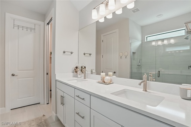 10415 Ventana Ln, Naples, FL 34120 - bathroom featuring double vanity, a shower stall, and tile patterned flooring