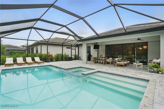 10415 Ventana Ln, Naples, FL 34120 - view of pool with a ceiling fan, a patio area, an outdoor living space, a pool with connected hot tub, and area for grilling