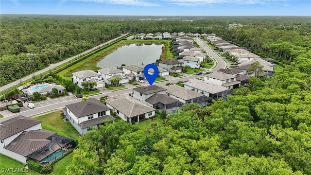 10415 Ventana Ln, Naples, FL 34120 - aerial perspective of suburban area with a heavily wooded area and a nearby body of water