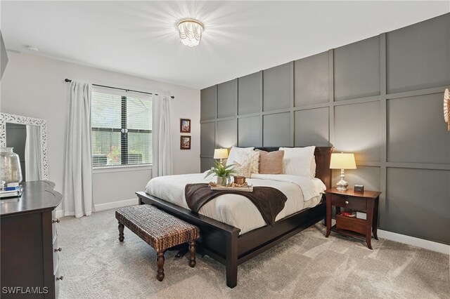 10415 Ventana Ln, Naples, FL 34120 - bedroom with light carpet and a decorative wall