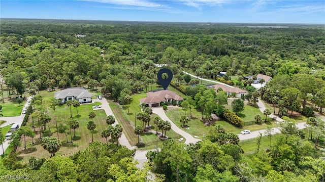 505 7th St NW, Naples, FL 34120 - view of property location with a heavily wooded area