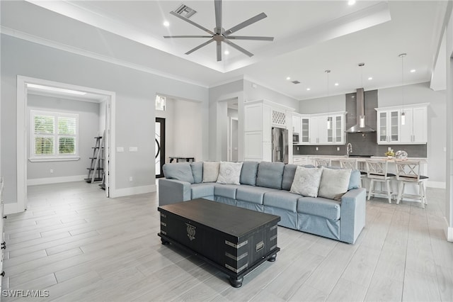505 7th St NW, Naples, FL 34120 - living area with a ceiling fan, recessed lighting, baseboards, light wood finished floors, and a raised ceiling