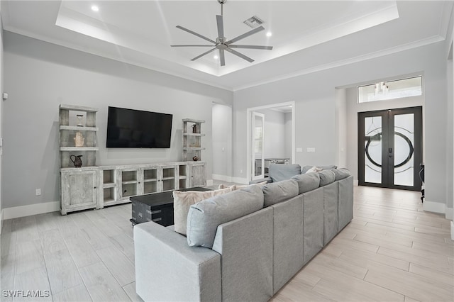 505 7th St NW, Naples, FL 34120 - living room featuring a tray ceiling, ceiling fan, french doors, light wood-style floors, and recessed lighting