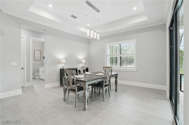 505 7th St NW, Naples, FL 34120 - dining space with a tray ceiling, baseboards, crown molding, recessed lighting, and light wood-type flooring