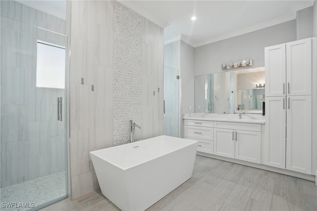 505 7th St NW, Naples, FL 34120 - full bath with a stall shower, vanity, a freestanding tub, and crown molding
