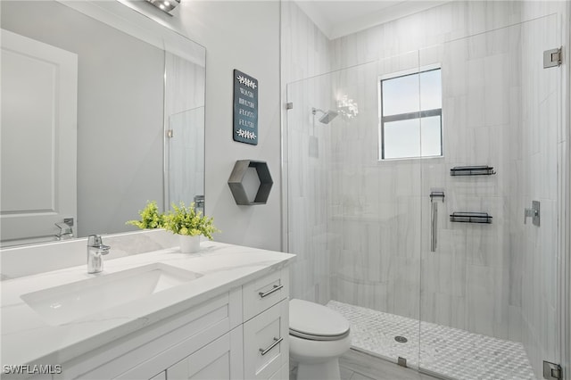505 7th St NW, Naples, FL 34120 - bathroom featuring vanity, toilet, and a stall shower