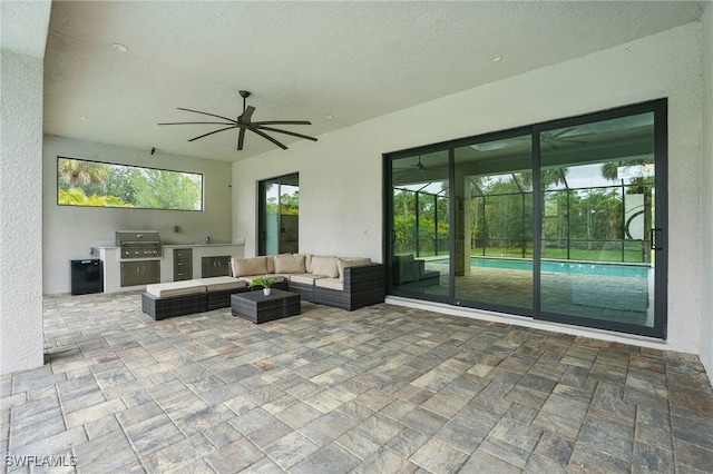 505 7th St NW, Naples, FL 34120 - view of patio / terrace with ceiling fan, outdoor lounge area, and glass enclosure