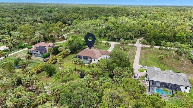 505 7th St NW, Naples, FL 34120 - view of property location with a forest and a pool area