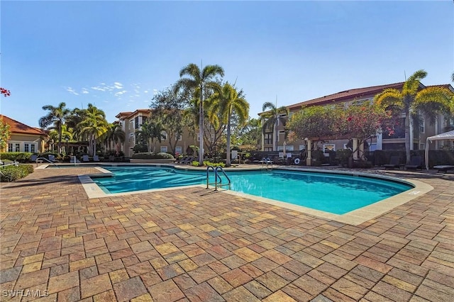 8950 Colonnades Ct E Unit 817, Bonita Springs, FL 34135 - community pool with a patio area