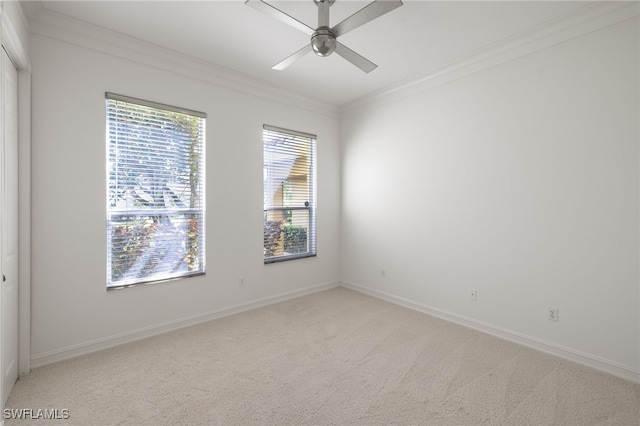 1880 Les Chateaux Blvd Unit 104, Naples, FL 34109 - unfurnished room featuring light carpet, ceiling fan, and crown molding