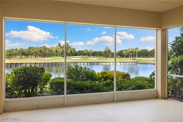 1880 Les Chateaux Blvd Unit 104, Naples, FL 34109 - unfurnished sunroom featuring golf course view, a water view, and view of scattered trees