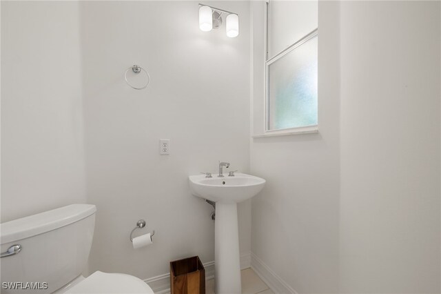 1880 Les Chateaux Blvd Unit 104, Naples, FL 34109 - half bath featuring toilet and baseboards