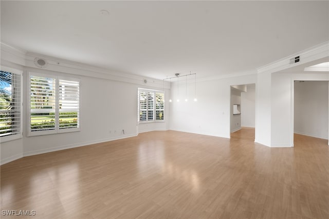 1880 Les Chateaux Blvd Unit 104, Naples, FL 34109 - spare room with crown molding and light wood-style flooring