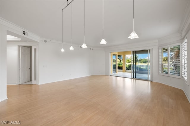 1880 Les Chateaux Blvd Unit 104, Naples, FL 34109 - unfurnished room with crown molding and light wood-style flooring