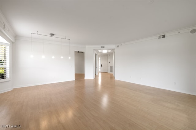 1880 Les Chateaux Blvd Unit 104, Naples, FL 34109 - unfurnished room with light wood-style flooring and ornamental molding